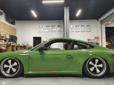 Green Porsche 911 airbag suspension ultra low profile